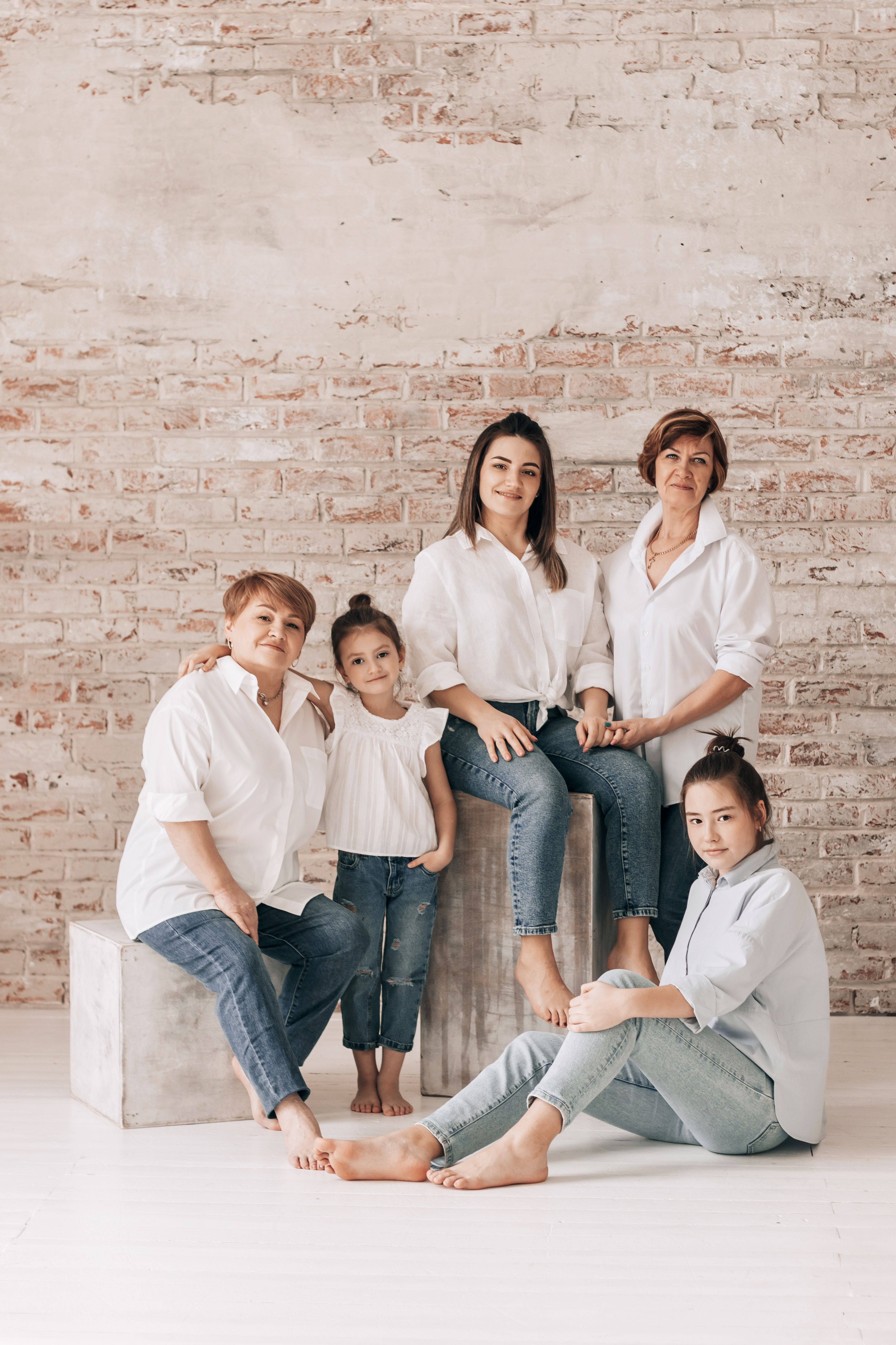 Four generations of women — grandmother, mother, teenager, and young girl — representing lifelong women's health care at Venus OB-GYN