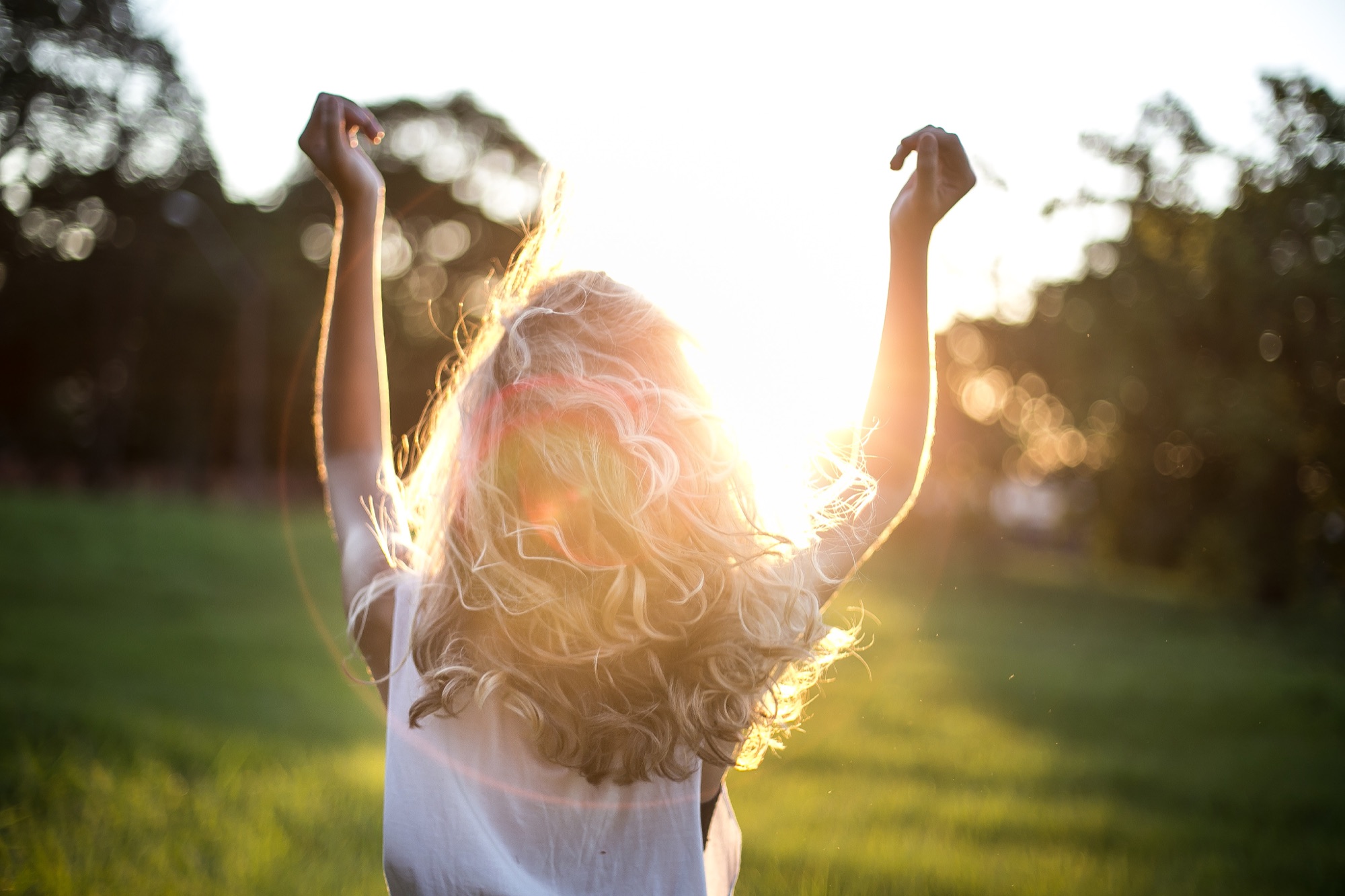 Woman smiling outdoors — preventive health care